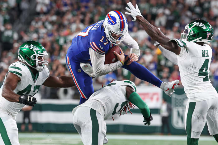 Buffalo Bills QB Josh Allen fights for extra yardage in Week 1 vs. the New York Jets.